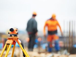 Construction staking survey for a new commercial building addition in Florida, showing precise layout near an existing structure. 

