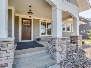 Flood-resistant building entry with raised threshold and landing planned using elevation certificate data.