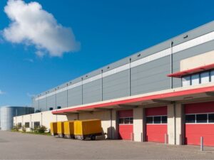 Warehouse exterior and loading area before commercial conversion.
